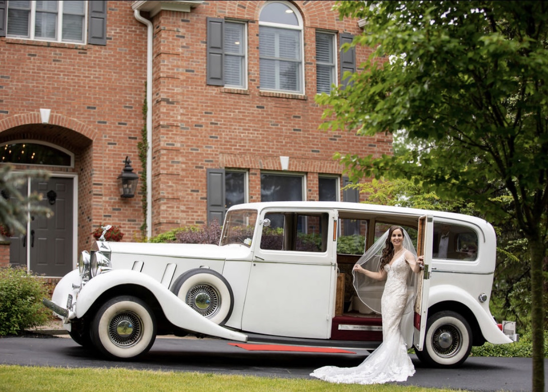 The image showcases a stunning antique car, highlighting its vintage design and luxury features. This classic vehicle represents the high-quality service RPD Limousine Service aims to provide, appealing to clients who appreciate elegance and style in their transportation choices.