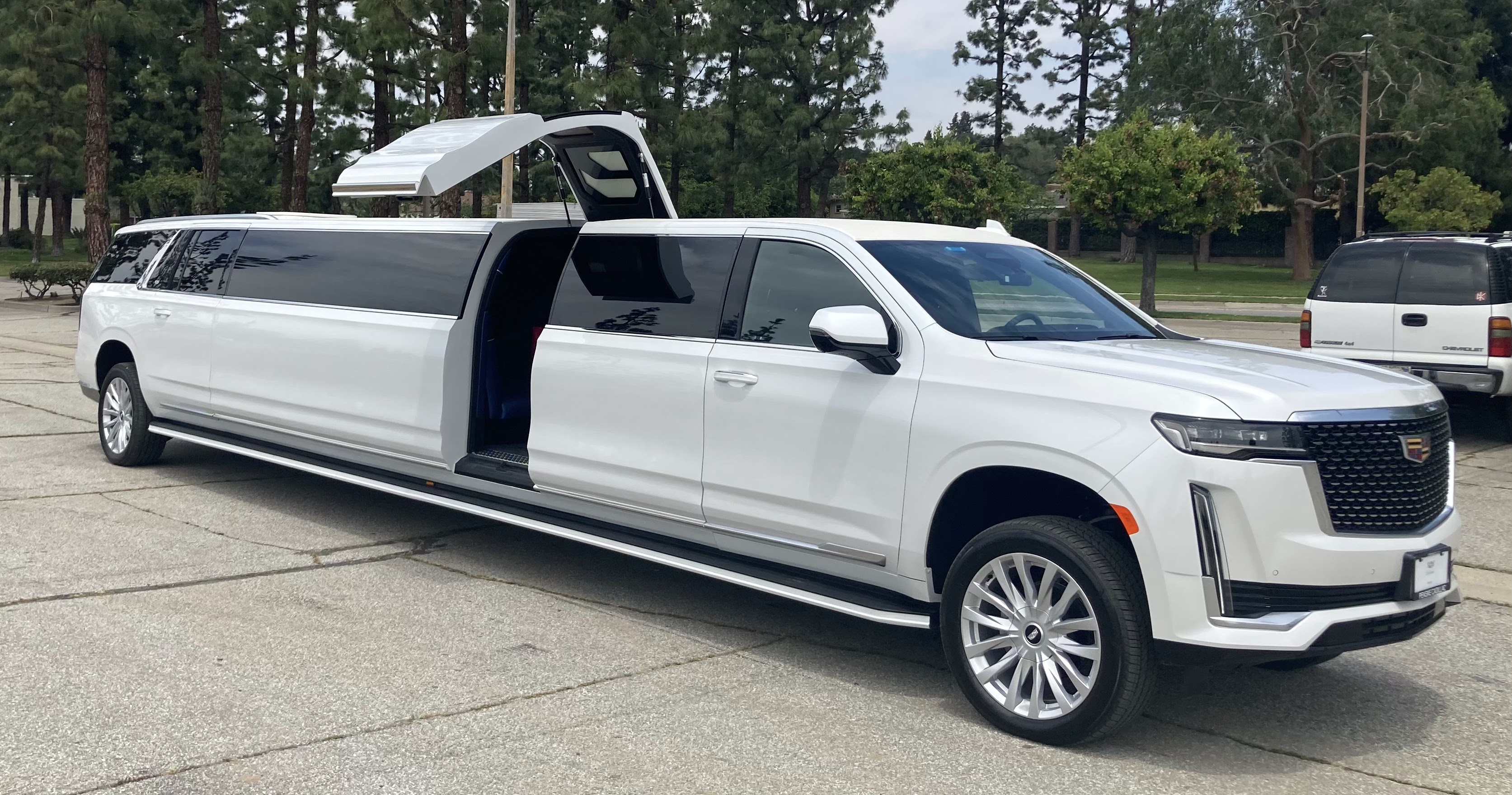 The image showcases a 2024 Cadillac Escalade stretch limousine, highlighting its luxurious exterior and premium features. This vehicle represents RPD Limousine Service's commitment to providing high-end transportation solutions for clients seeking elegance and comfort.