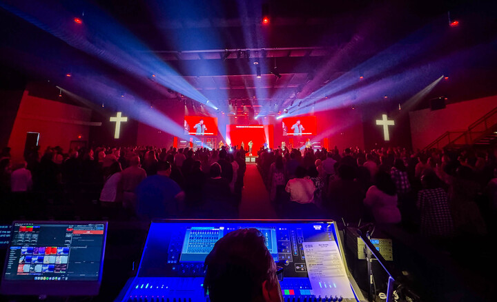 The image showcases a vibrant stage setup with dynamic lighting, ideal for a performance or worship event at Cornerstone Church Athens. This visual highlights the church's commitment to creating engaging and uplifting experiences for the community through music and the arts.